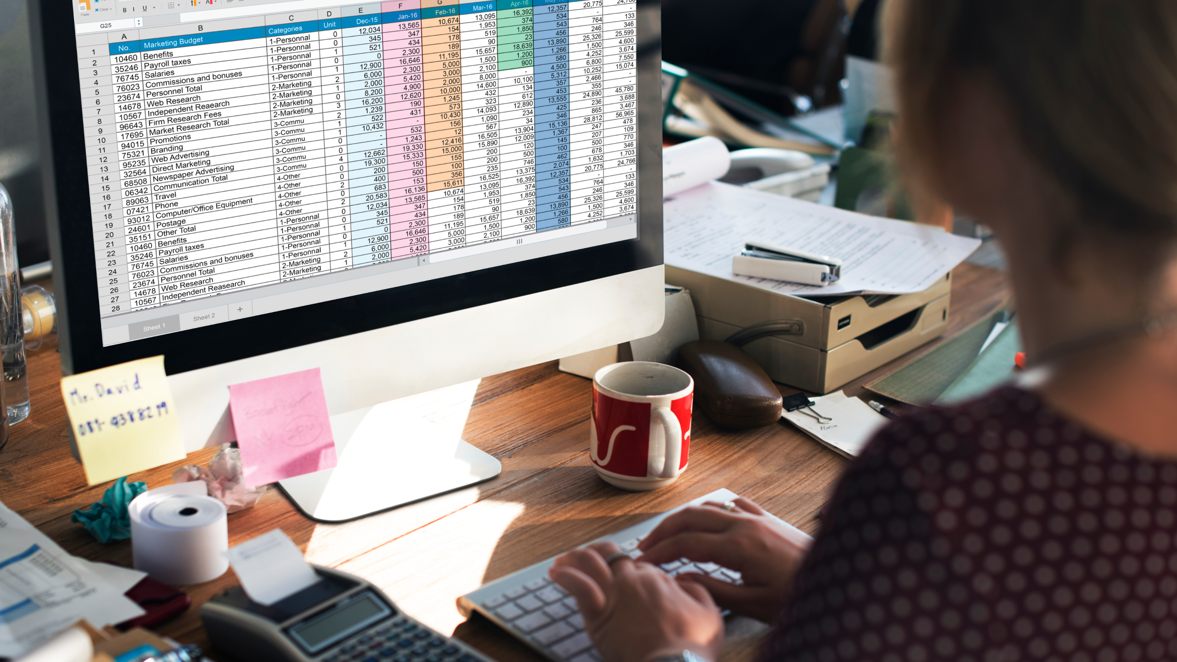 Small business owner organising VAT files for quarterly tax return with help from their accountant